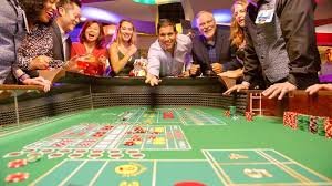 Detailed table card showing Dragon Tiger limits, dealer language, number of seats occupied, and real-time updates
